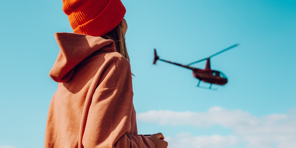 girl looking at a helicopter