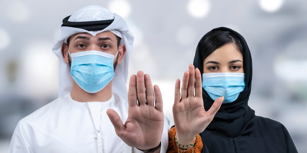 Arab man and woman wearing mask